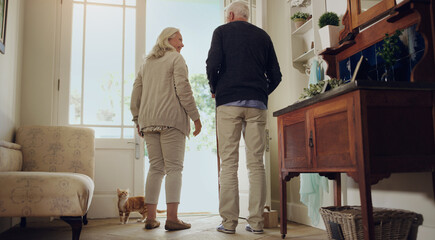 Smile, senior couple and door in home together for conversation, back and leave for walk with pet...