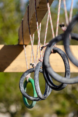 selective focus. detail of the rings of one of the obstacles of an obstacle race course, ocr