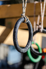 selective focus. detail of the rings of one of the obstacles of an obstacle race course, ocr