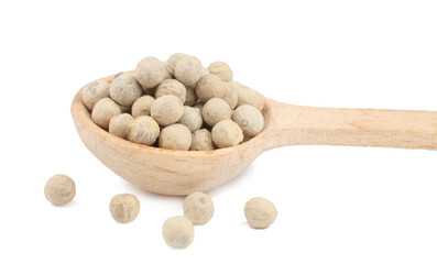 White pepper peas in the wooden spoon isolated on a white background