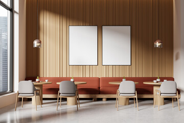 Fototapeta premium Interior of a modern cafe with blank posters on the wall, wooden design elements, and minimalist furniture, concept of interior design. 3D Rendering