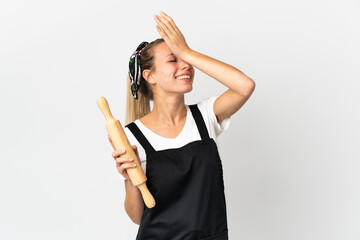 Young woman holding a rolling pin isolated on white background has realized something and intending the solution - obrazy, fototapety, plakaty