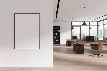 Obraz premium Stylish coworking interior with pc monitors on tables, window. Mockup frame