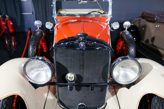 Details with the front part and emblem of a 1929 Graham Paige roadster retro car.