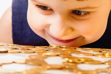 Happy beautiful little business child girl with coins. - 790641281