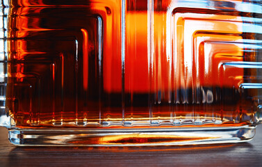 Rich glass texture of luxury cognac bottle in detail background