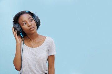 Thinking, music or headphones by black woman with mockup for sound, track or listening to podcast...