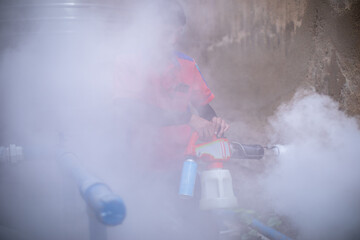 Officials are spraying mosquito repellent in the area of house to prevent dengue mosquitoes as...