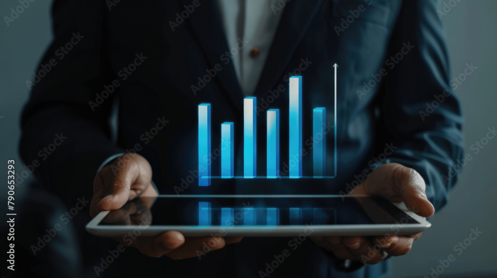 Poster a man in a suit holding a tablet displaying a bar chart
