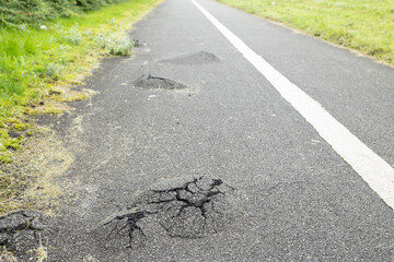 Dangerous road, path with holes destroyed