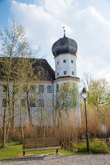 historic water castle, place with bench and lantern, upper bavaria