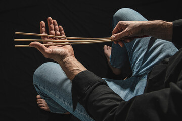 Strict man with rattan cane.