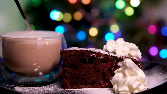 Girl holding a mug with a beautiful warm drink in her hands, new year's house, lights and shine 4K