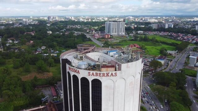 2 March 2024 - Kuching, Sarawak, Malaysia: Wisma Saberkas building on a cloudy day. Wisma Saberkas is one of the oldest building. A shopping mall specialised with IT, gadgets and telco products.
