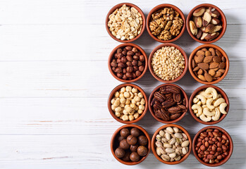Mix of nuts in bowl . Food background