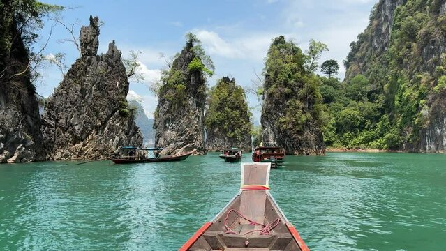 Cheow lan lake view on a long tail boat in Khao Sok national park, Surat Thani, Thailand