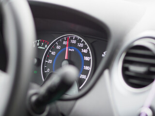 A car's speedometer shows a reading of 140 km/h