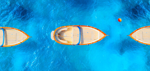 Drone view of a motor boat. Luxury transportation. Vacation and holidays. Summer time for sea travel. The sea bay. Photo for background and wallpaper. Mediterranean Sea. - 790660482