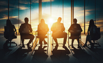 Double exposure image of many business people conference group meeting on city office building in...