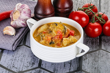 Traditional yellow Thai curry with chicken