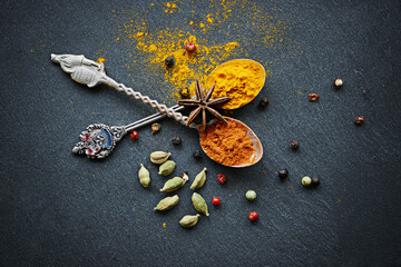 Above, spices and spoon for flavor and dry ingredient for cooking, cuisine and food on table top...