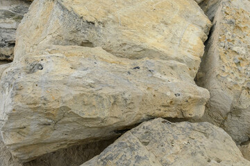 stones strengthening the sea shore in the port texture background