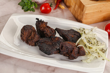 Grilled beef barbecue served onion