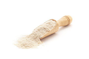 Front view of a wooden scoop filled with Organic Wheat Flour (Triticum). Isolated on a white...