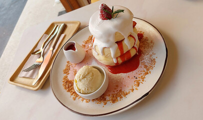 Japanese strawberry souffle pancake with vanilla ice cream.