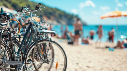 Parked bicycles near the sunny beach with blurred people. leisure and people concept, summer concept with copy space
