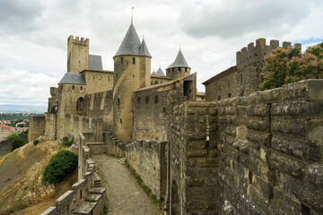 Fototapeta na wymiar Carcassone castle with ramparts on sunny day, popular tourist landmark in France