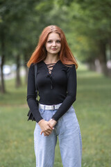 Obraz premium Portrait of a young beautiful red-haired girl.