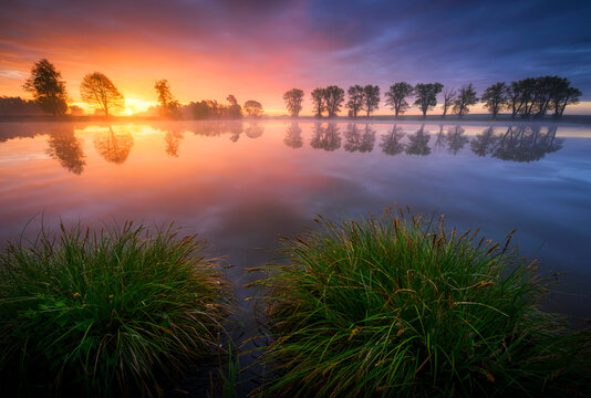 Colorful spring sunrise over the lake