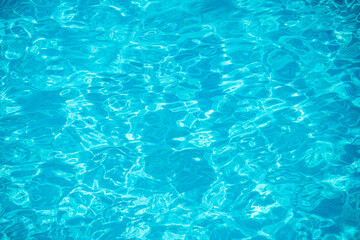 Swimming pool bottom caustics ripple and flow with waves background. Summer background. Texture of water surface. Overhead view. - 790689830