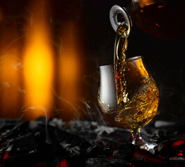 Snifter of brandy on a burning charcoal.