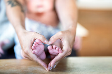 newborn baby girls feet. - 790704817