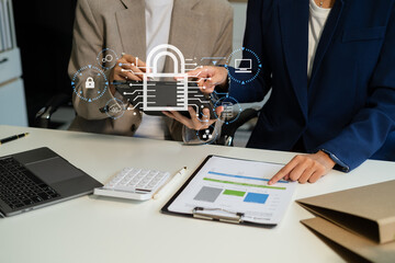 Cybersecurity and privacy concepts to protect data. Lock icon and network security technology. Man protecting personal data on smartphone tablet, virtual screen interfaces. In office