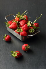 Strawberry fruits on a black background