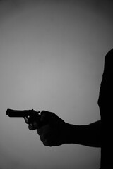 Man spy detective holding pistol gun