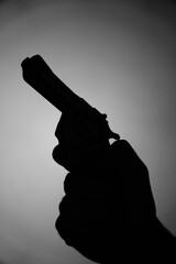 Man spy detective holding pistol gun