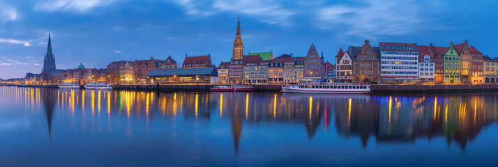 Bremen panorama. City skyline reflected in water at night, creating a stunning afterglow. Generative AI - obrazy, fototapety, plakaty