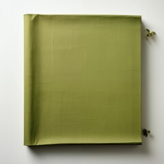 Green square of fabric neatly folded and hung on a wall as decorative textural art