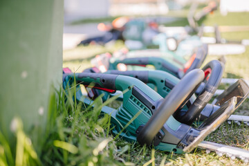 Valmiera, Latvia - April 21, 2024 - Gardening tools laid out on the grass, with focus on the...