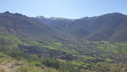 Green valley snow capped mountains Sierra Béjar Spain