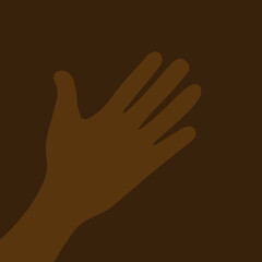 African dark-skinned person's hand on brown background