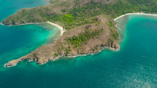 Tropical landscape with a beautiful beach in the blue water.