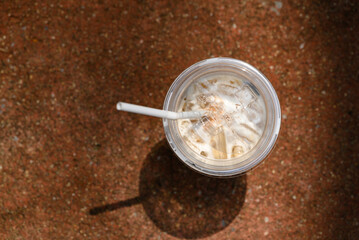 Iced cappuccino coffee with sunlight in summer season, Top view