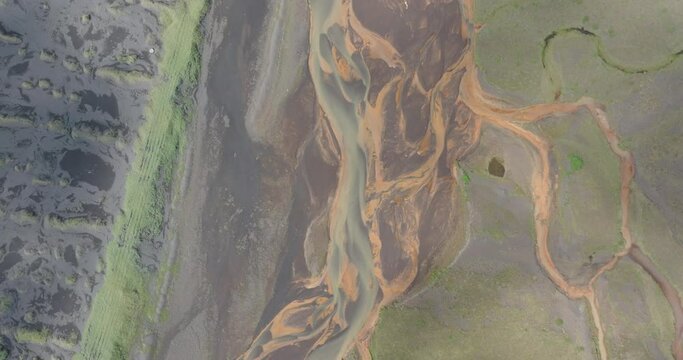 Aerial Top Forward Beautiful Shot Of Braided River Streams Flowing On Landscape - Unknown, Iceland
