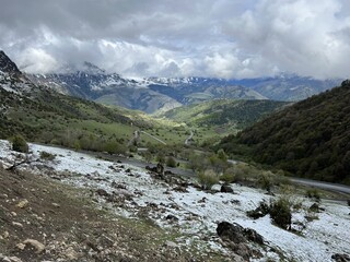 Tseylomsky pass in Ingushetia. A trip uphill to the Tsei Loam pass on a cloudy spring day. Panorama...
