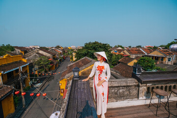 Asian woman wearing vietnam  traditional culture  walking around at Hoi An ancient town,Hoi an city in Vietnam.